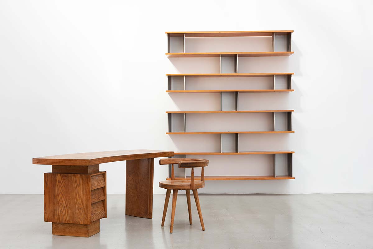 Galerie Patrick Seguin: Asymmetrical wall mounted bookshelves, 1958 by Charlotte Perriand; Desk, 1953 by Pierre Jeanneret; Swiveling Office Chair, 1953 by Pierre Jeanneret and Charlotte Perriand